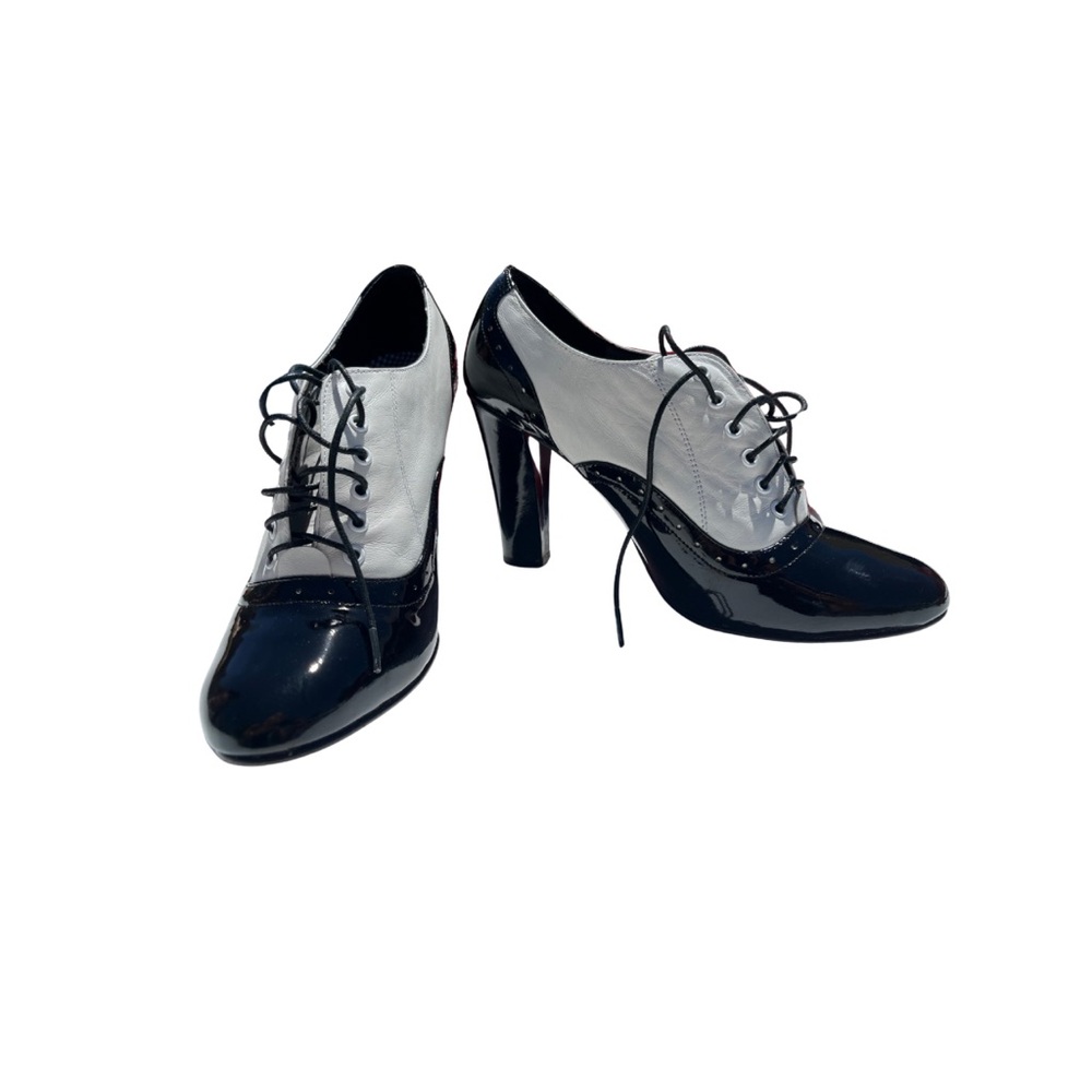 Black and white heels ! Tie up and great pump , new condition
